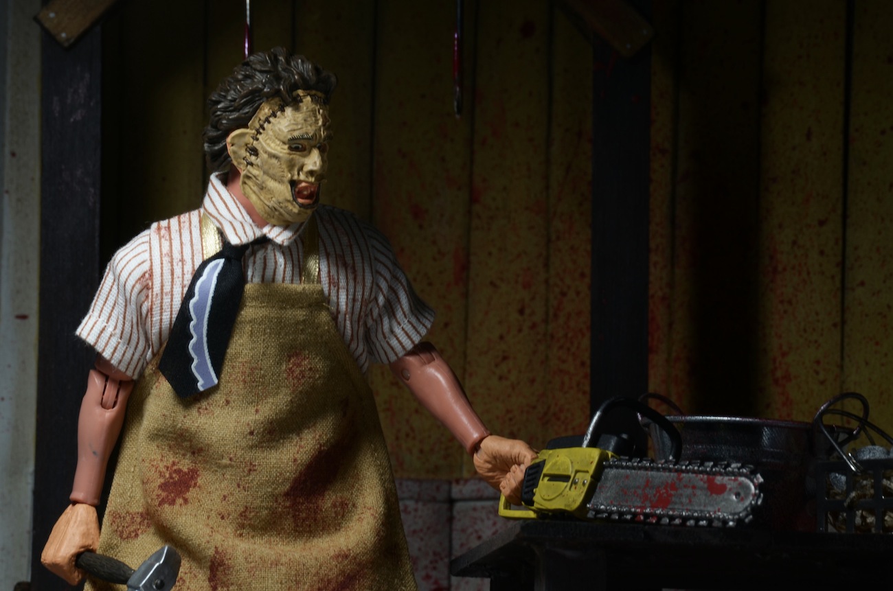 The 8" Leatherface figure wears his classic outfit from the gory 1974 ...