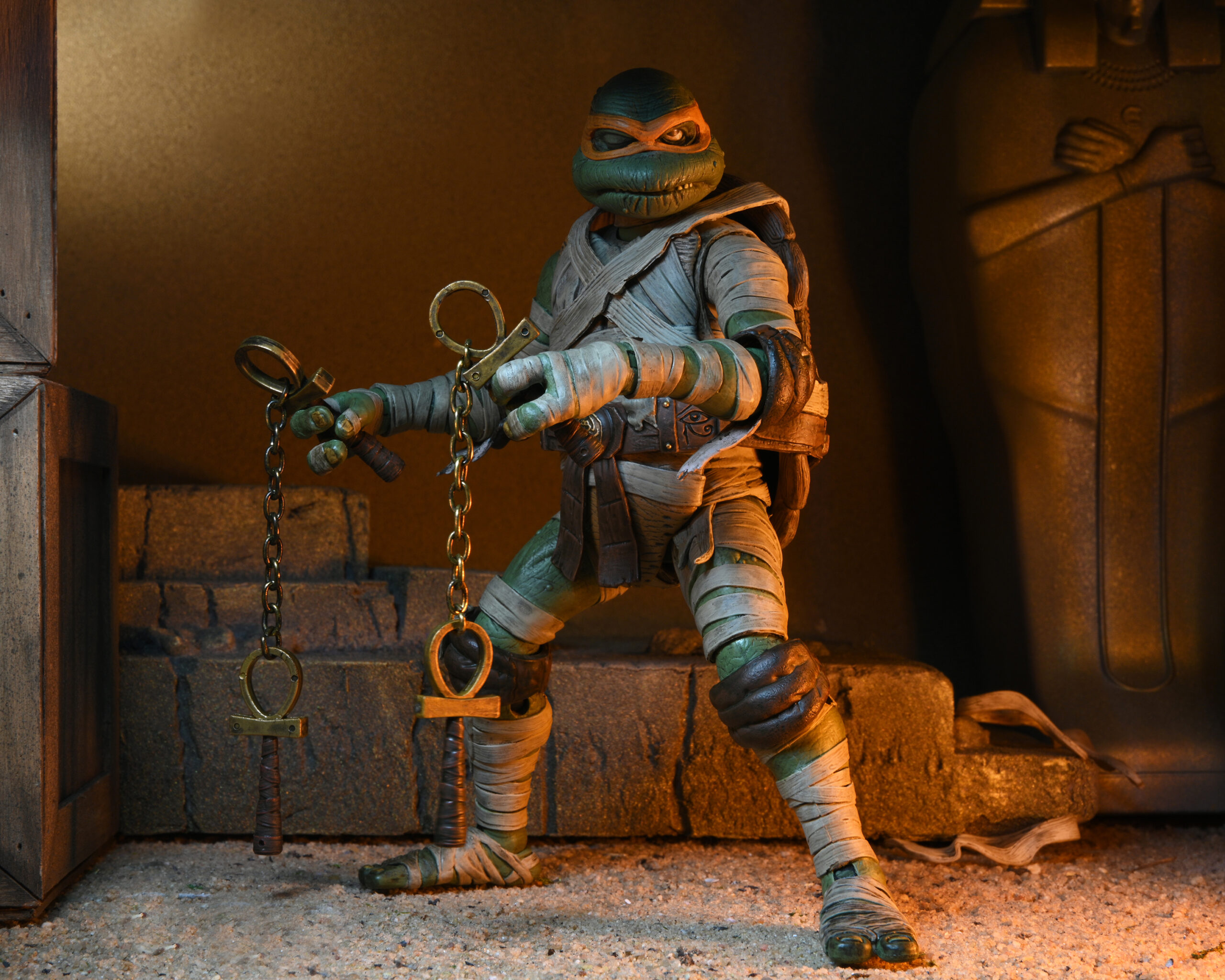 NECAOnline.com | Universal Monsters/Teenage Mutant Ninja Turtles - 7" Scale Action Figure - Ultimate Michelangelo as The Mummy