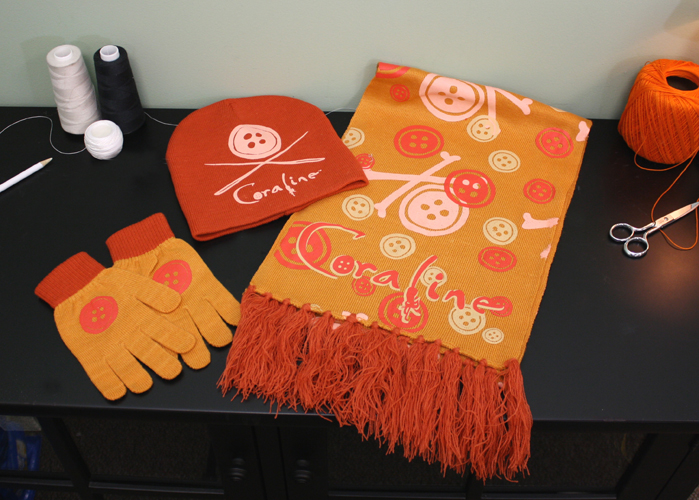NECAOnline.com | DISCONTINUED: Coraline – Hat, Scarf and Gloves Set – Orange Buttons